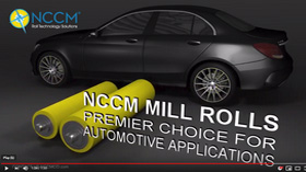 Two automotive NCCM<sup>®</sup> Premier Yellow nonwoven rolls sitting in front of a car